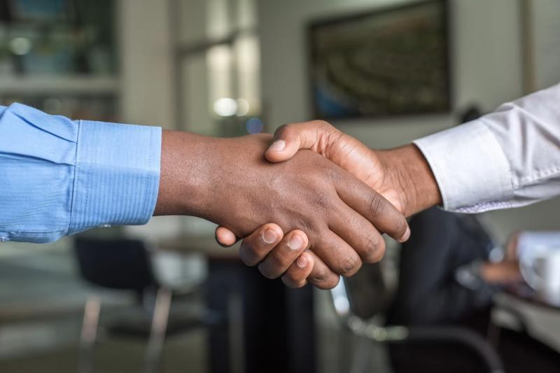 Wealth Vault Zone advisor shaking hands with a client